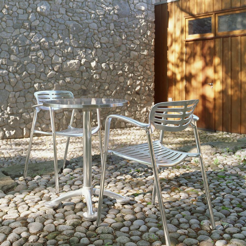 Knoll Pensi Cafe Table on Stone Patio with Toledo Chairs