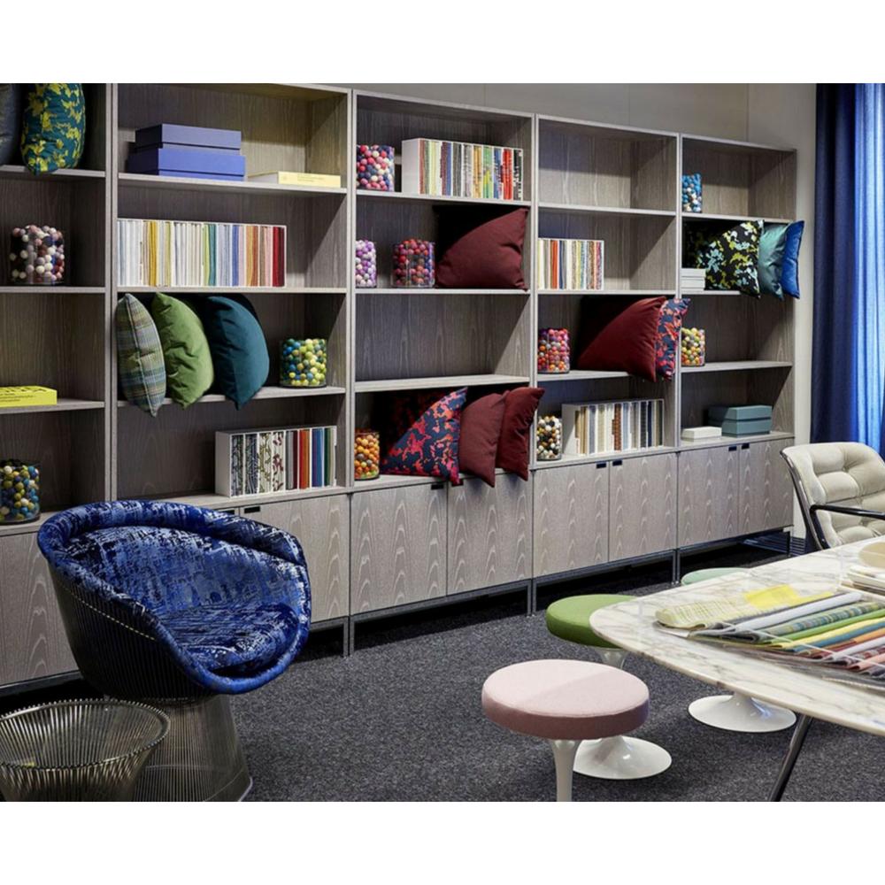 Knoll Platner Armchair in room with Tulip Stools and Florence Knoll Cabinets Neocon 2018