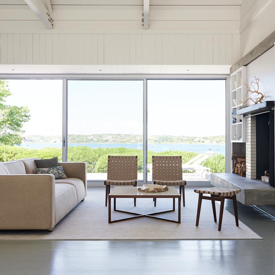 Knoll Krusin Coffee Table in room with Risom Chairs and stool and Barber Osgerby Asymmetric Sofa