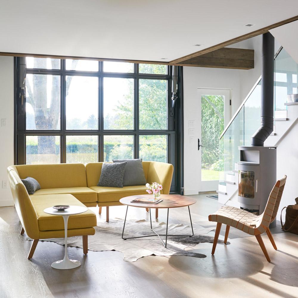 Knoll Risom Lounge Chair in room with Saarinen Side Table and Rockwell Unscripted Sofa