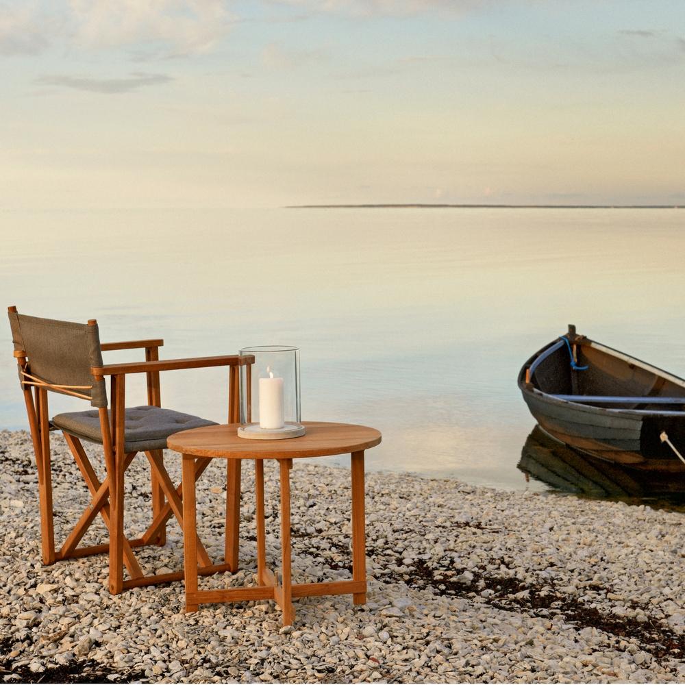 Kryss Lounge Chair with the Kryss Table and Marstrand Candle Lantern by Skargaarden