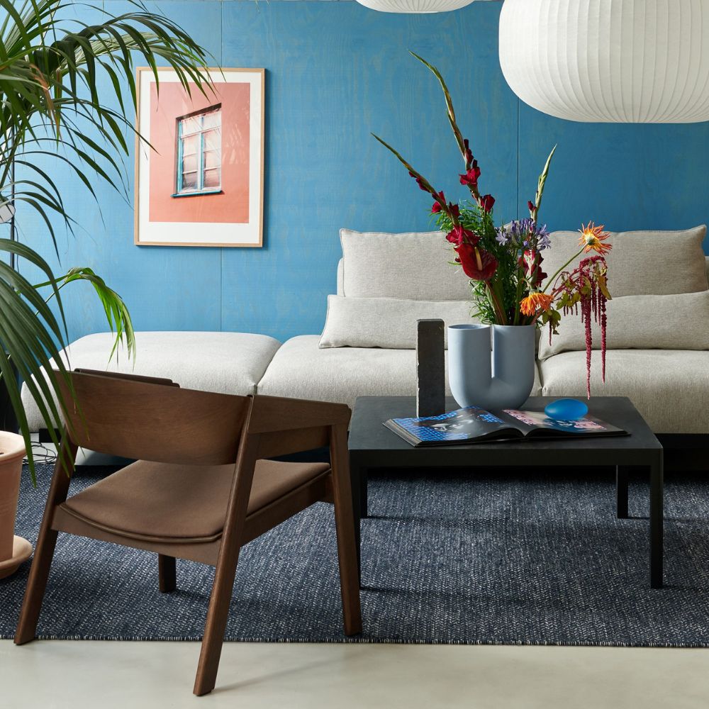 Muuto In Situ Modular Sofa in room with Cover Chair and Strand Pendant Lights
