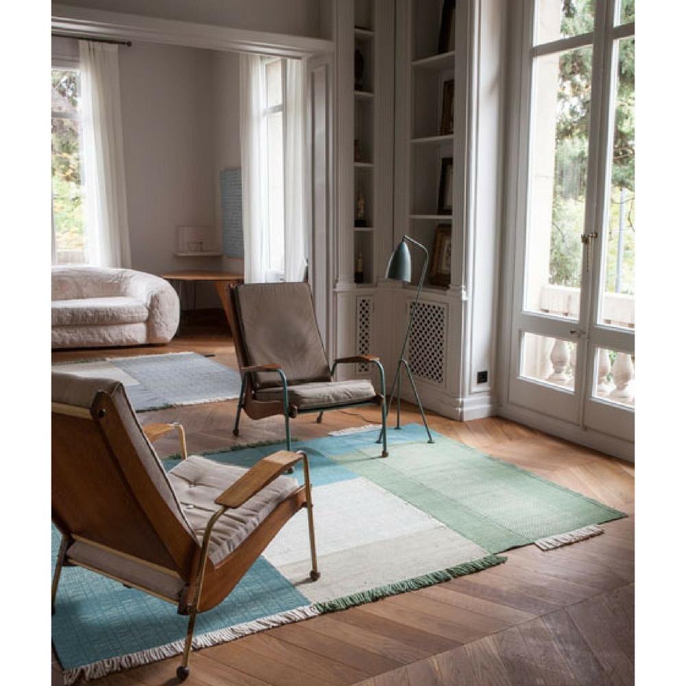 Nani Marquina Tres Rug Green in room