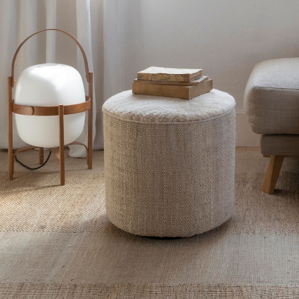 nanimarquina Tres Persian Pouf Vegetal in room with Santa Cole Cestita Lamp