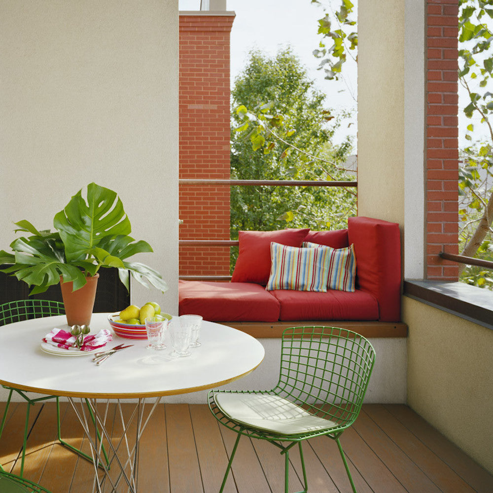 Noguchi Cyclone Table Outdoors with Bertoia Chairs