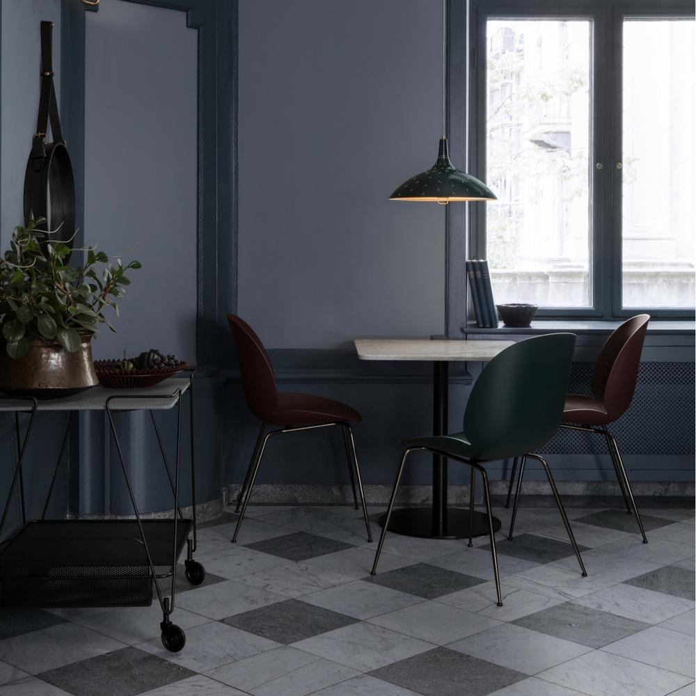 Paavo Tynell's 1965 Pendant with Bistro Green Shade, Beetle Dining Chairs, Gubi 1.0 Squared Dining Table, Matégot Trolley, and Adnet Circular Wall Mirror by GUBI