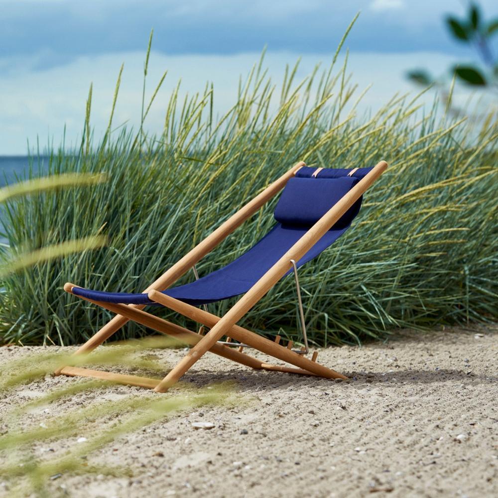 Skargaarden H55 Sun Lounger on Beach Navy Blue Sunbrella and Teak