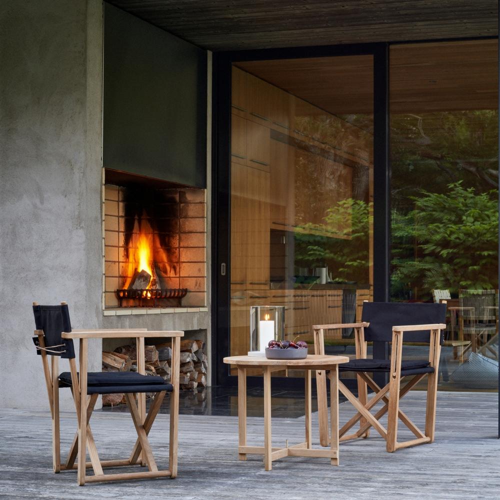 Skargaarden Kryss Table with Kryss Lounge Chairs and Möja Candle Lantern
