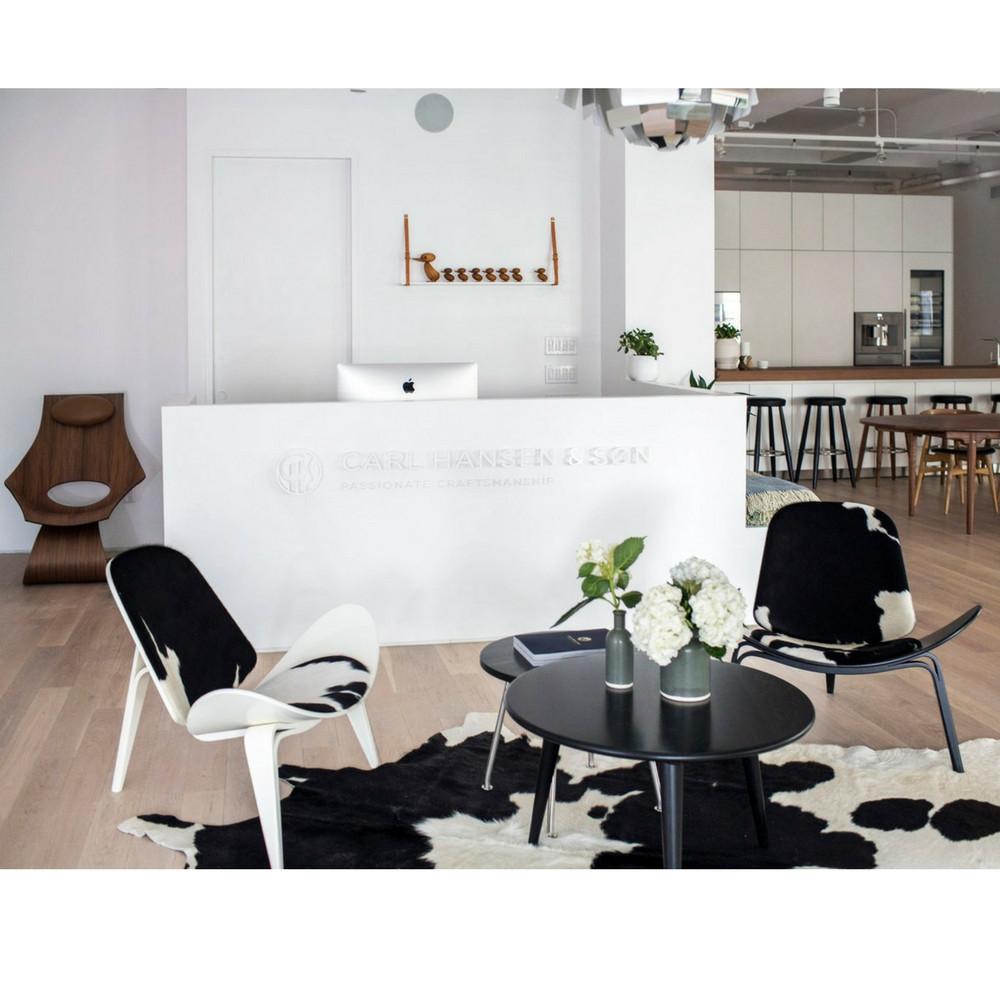 Wegner CH008 Coffee Table in Black with Black and White Cowhide Shell Chairs in Carl Hansen Showroom