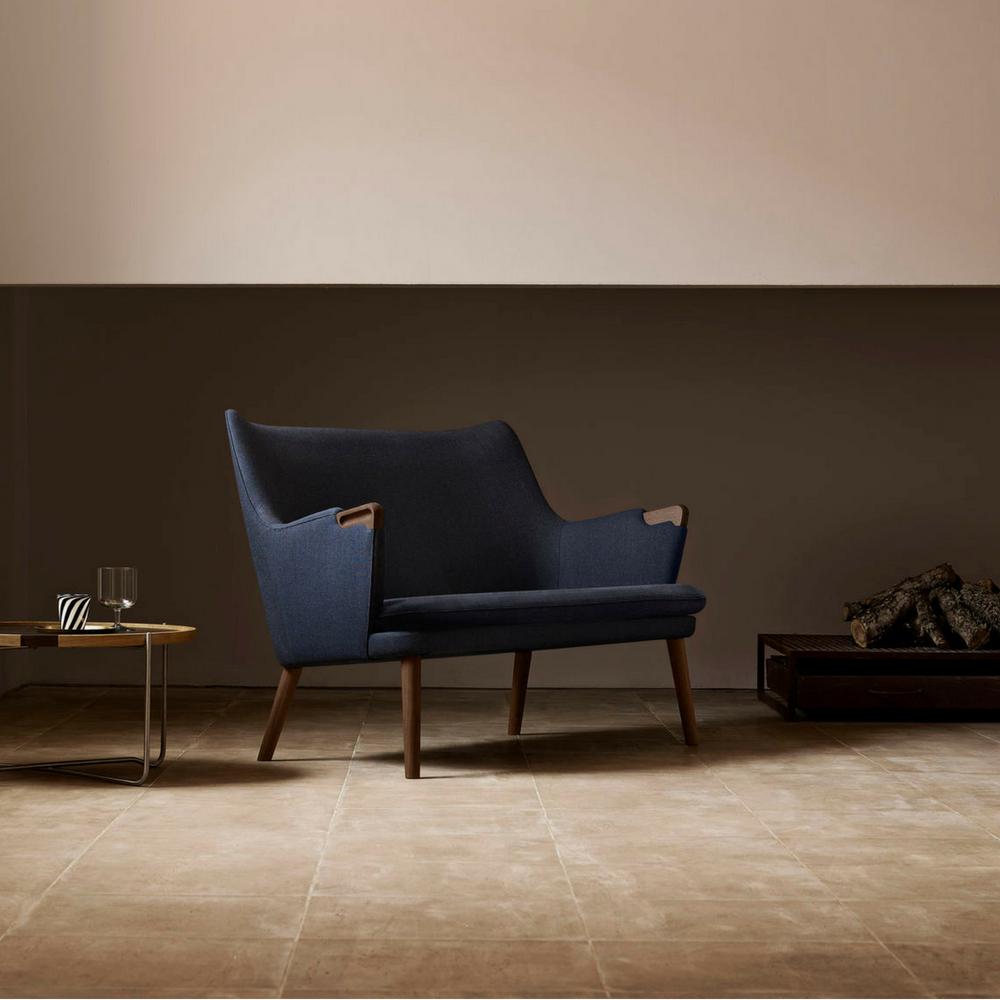 Wegner CH72 Sofa Dark Blue with Walnut Base styled in room