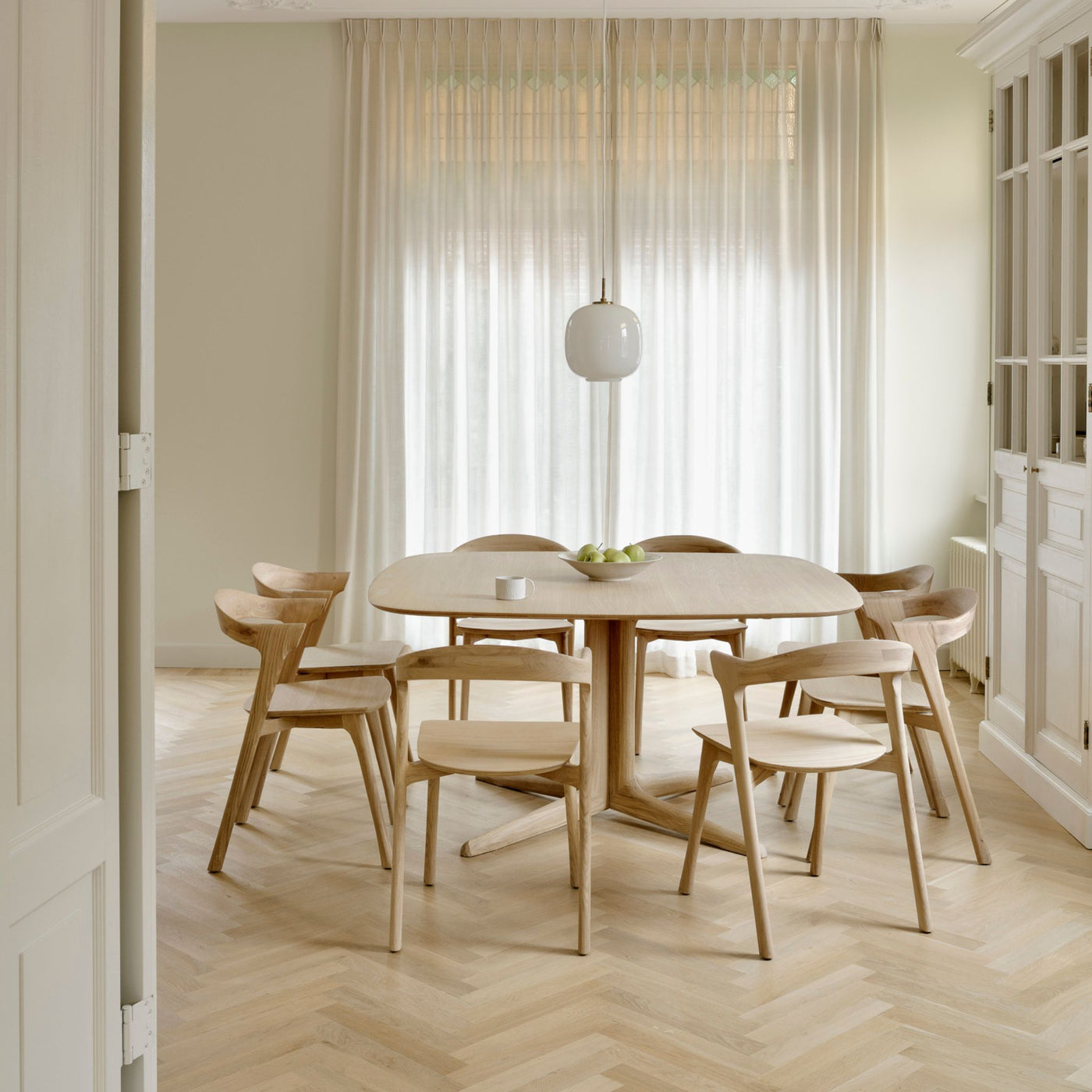 Ethnicraft Corto Dining Table and Bok Chairs in Dining Room with Herringbone Floors and Louis Poulsen Pendant