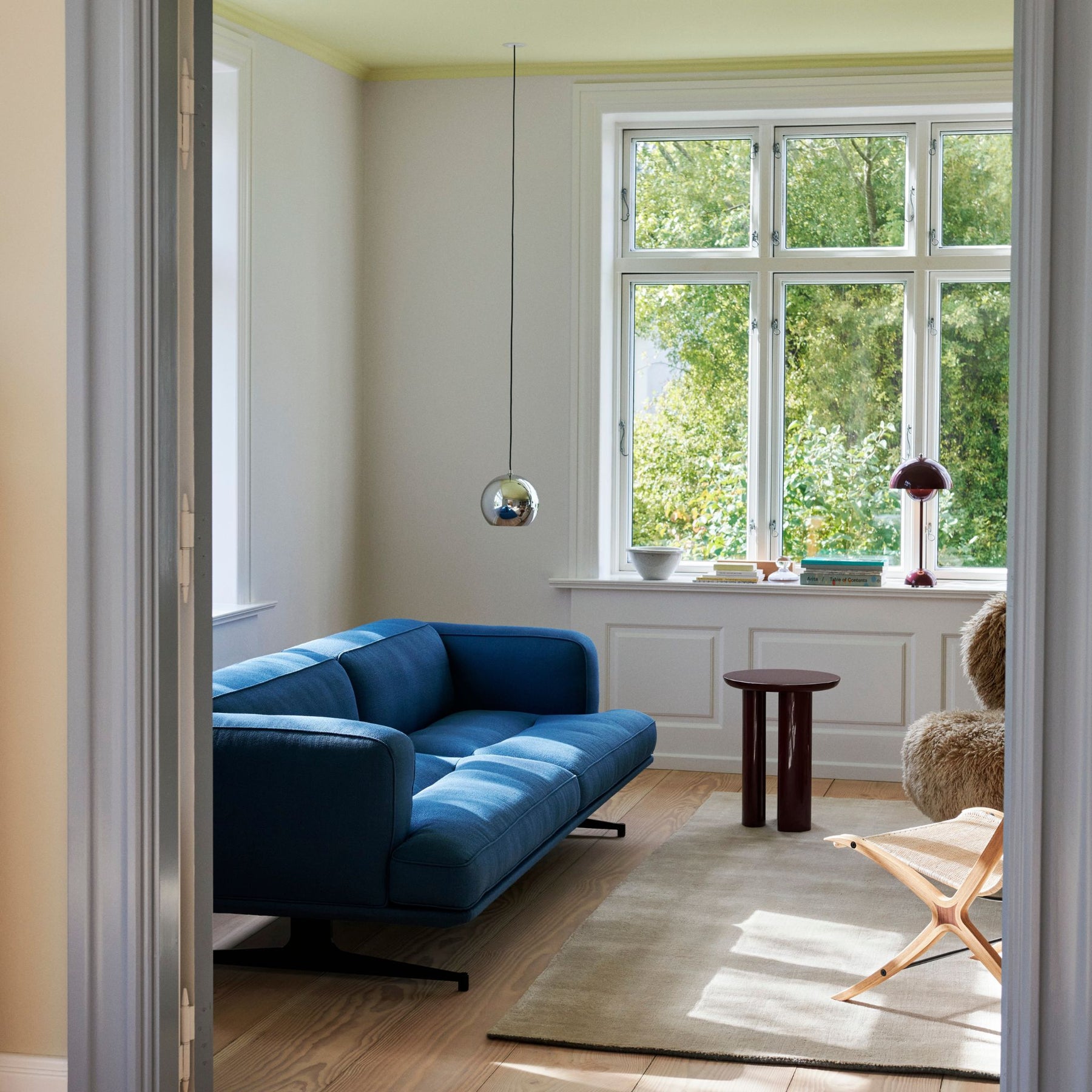 And Tradition VP6 Topan Pendant Chrome in Living Room with Blue Sofa