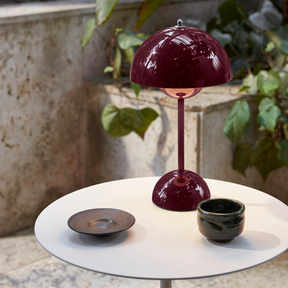 andTradition VP9 Flowerpot Lamp Deep Plum on Stone Terrace