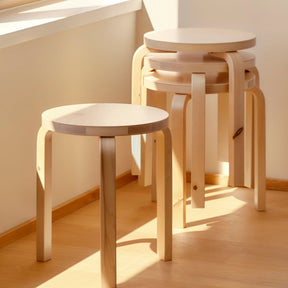 Artek Alvar Aalto Stool 60 Natural Birch Stacked by Window Golden Hour