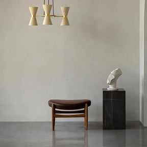 Audo Copenhagen Collector Chandelier by Alf Svensson with the Elizabeth Ottoman and Tall Plinth