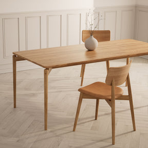 Bruunmunch Chiara Dining Chairs in Room with PURE Dining Table and herringbone floors