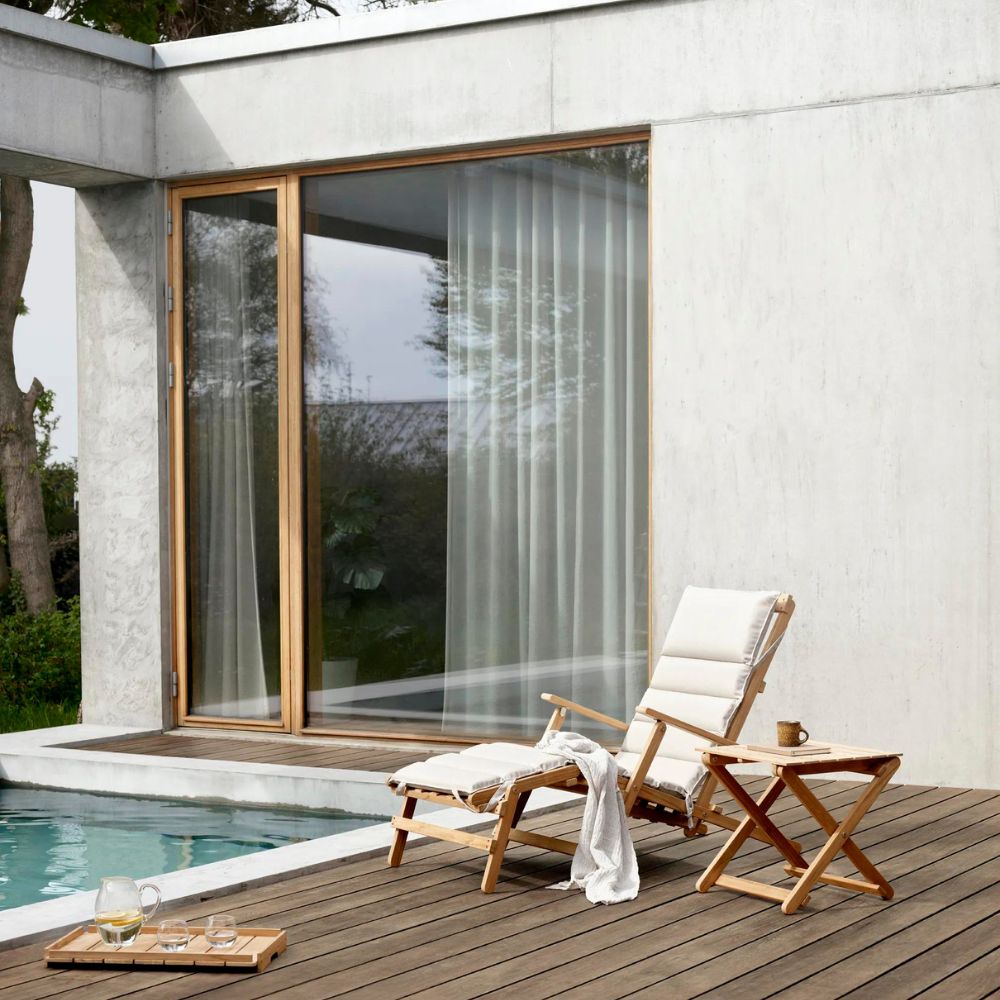 Carl Hansen BM5868 Teak Side Table with Deck Chair by Borge Mogensen next to Pool