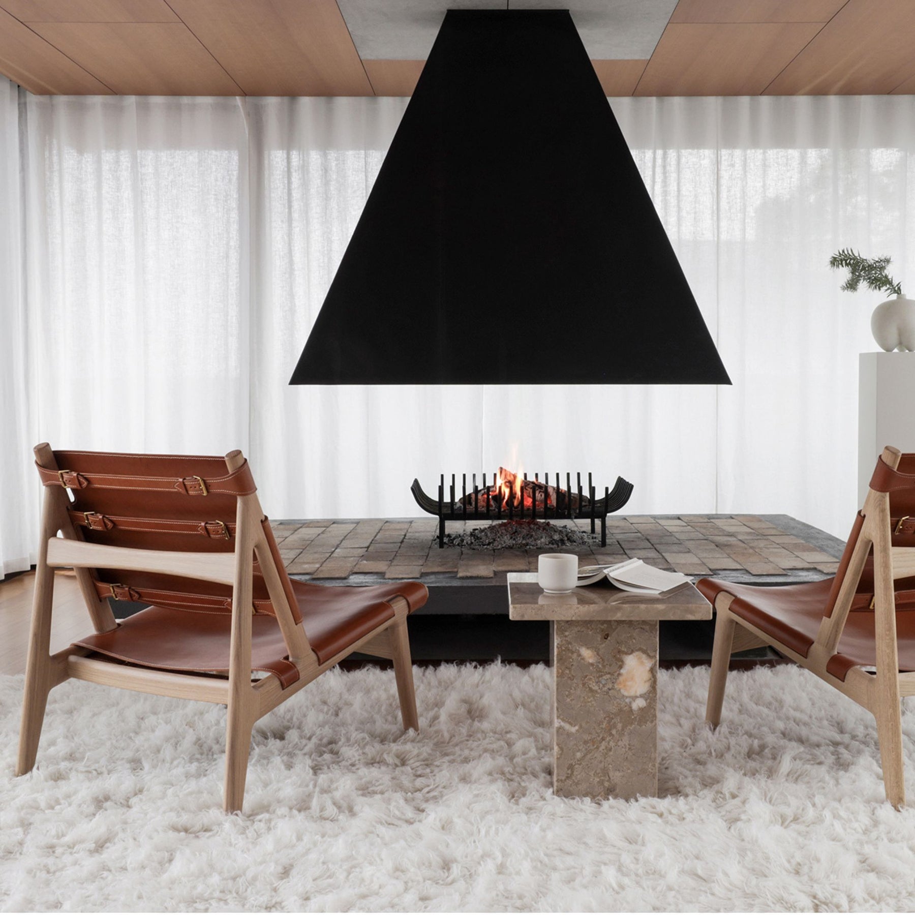 Eikund Hunter Chairs Cognac Saddle Leather with Oak Oil Frame on Cozy Shag Rug by Fireplace