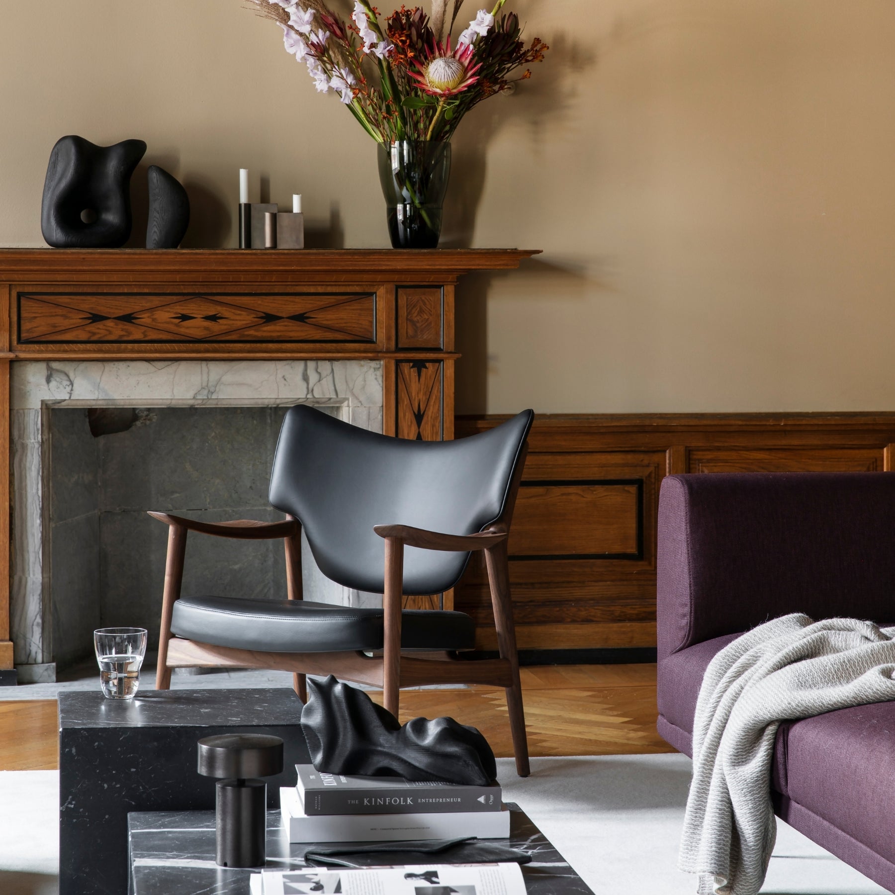 Eikund Veng Lounge Chair Black Leather by Fireplace
