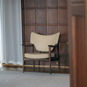 Eikund Veng Lounge Chair Butter Yellow in Wood Paneled Room