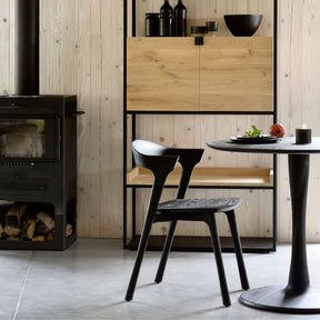 Ethnicraft Black Oak Torsion Dining Table with Bok Chair and Cozy Wood Stove