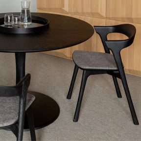 Ethnicraft Black Oak Torsion Dining Table Round with upholstered Black Oak Bok Chairs