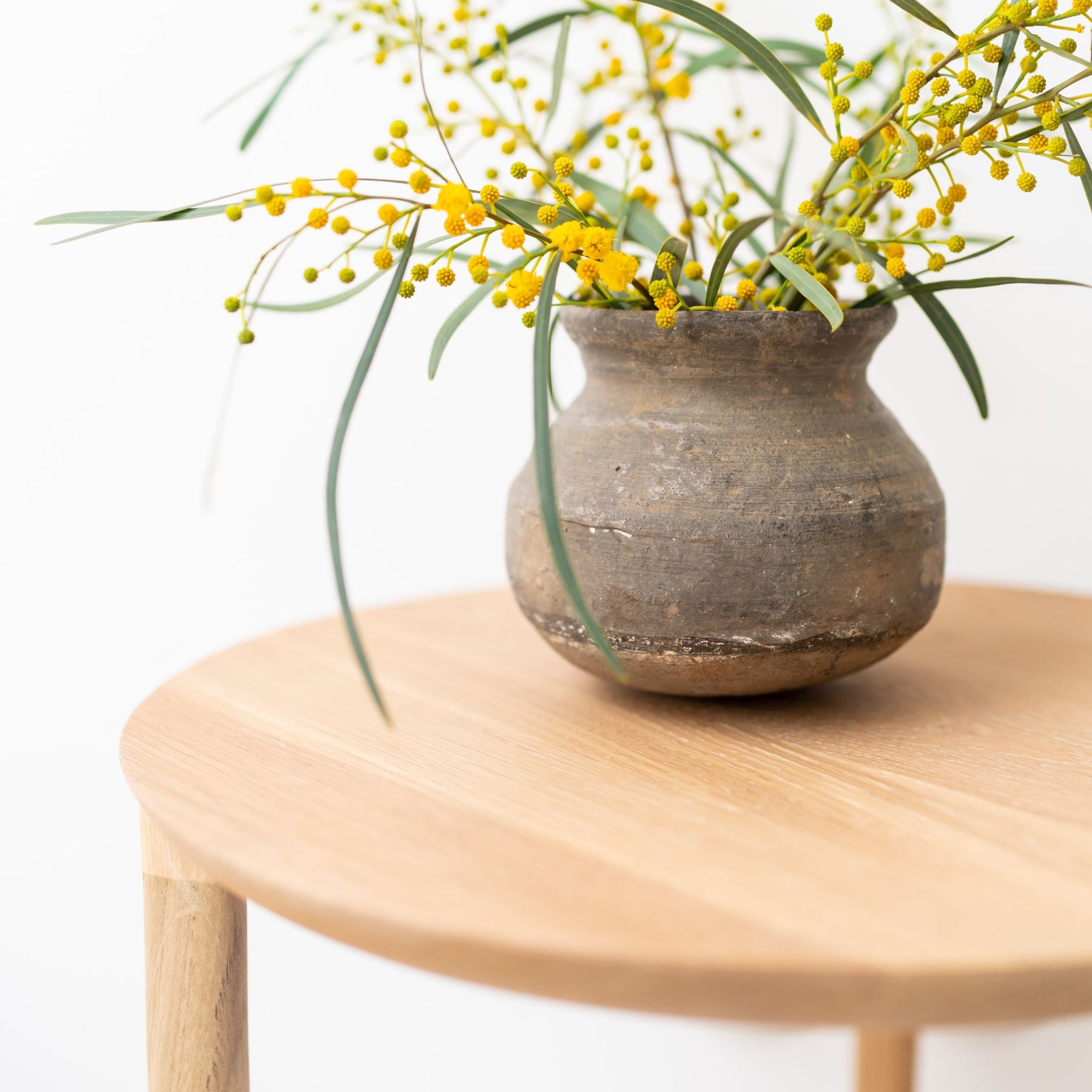 Ethnicraft Oak Bok Side Table with Yellow Flowers Top Detail