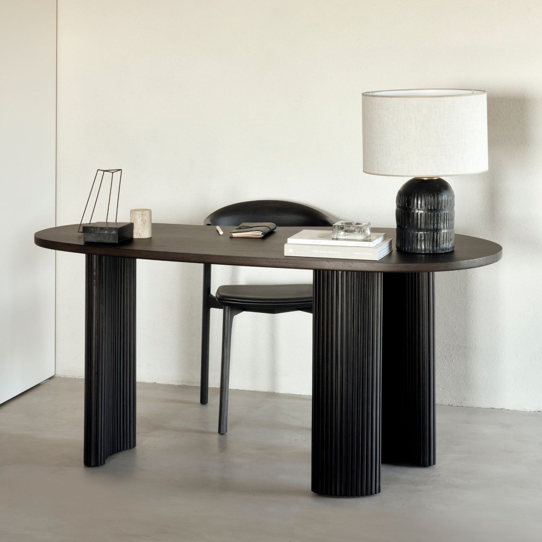 Ethnicraft Boomerang Desk Mahogany 35011 with Books and Lamp