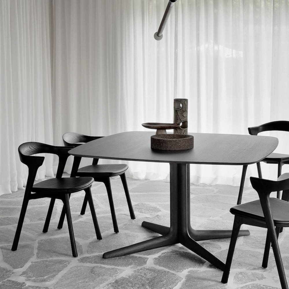Ethnicraft Corto Dining Table Dark Brown Stained Oak in Dining Room with Bok Chairs and Stone Floor