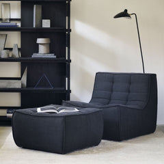 Ethnicraft Dunes Rug Sand in room with N701 Chair and Ottoman in Graphite