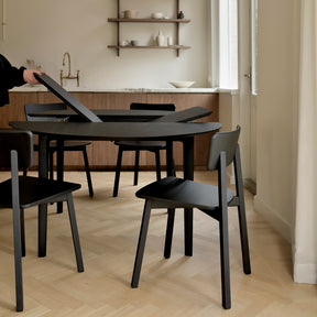 Ethnicraft Black Oak Bok Round Extendable Dining Table 51528 in Kitchen as it's being Extended