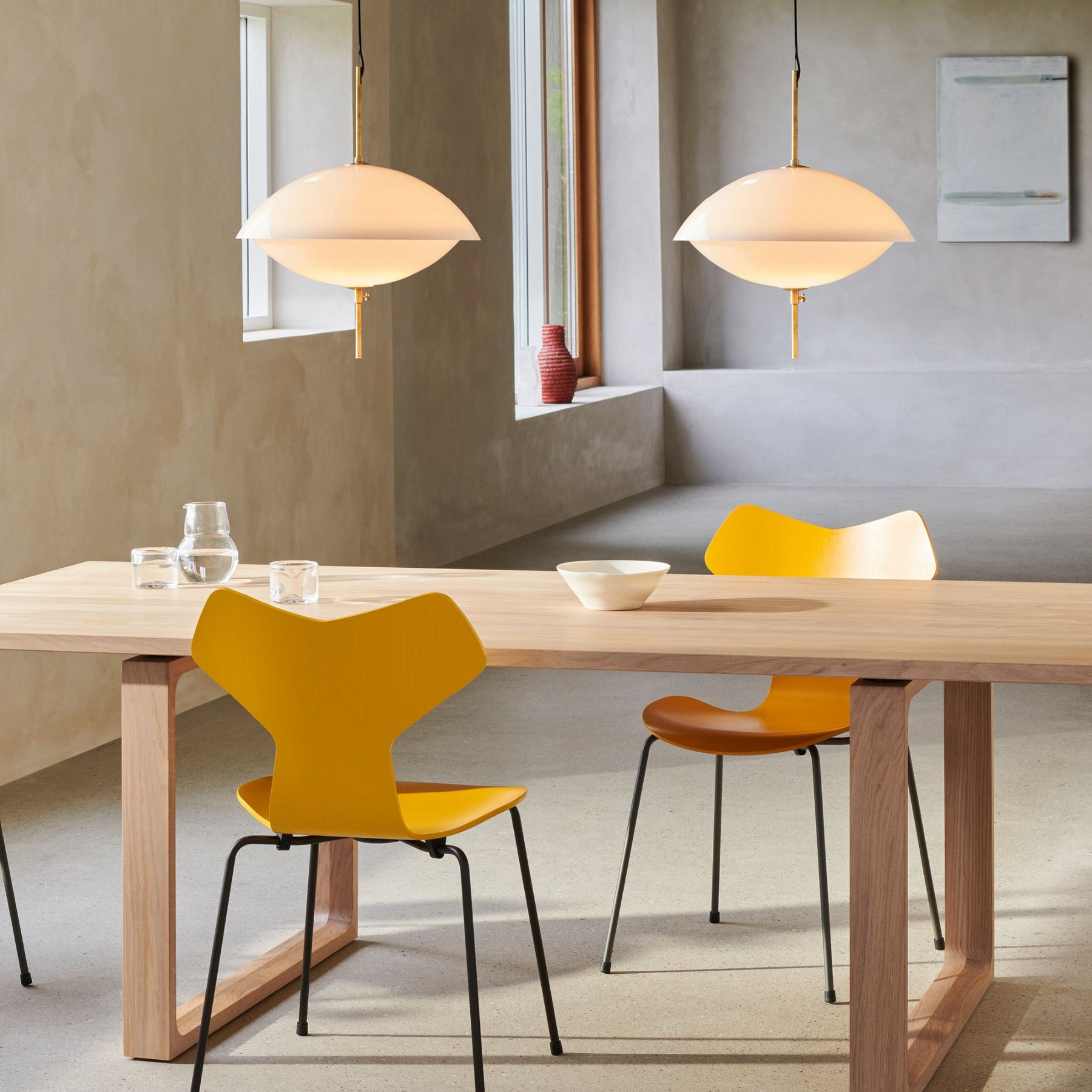 Fritz Hansen Clam Pendants with Essay Table and Yellow Grand Prix Chairs