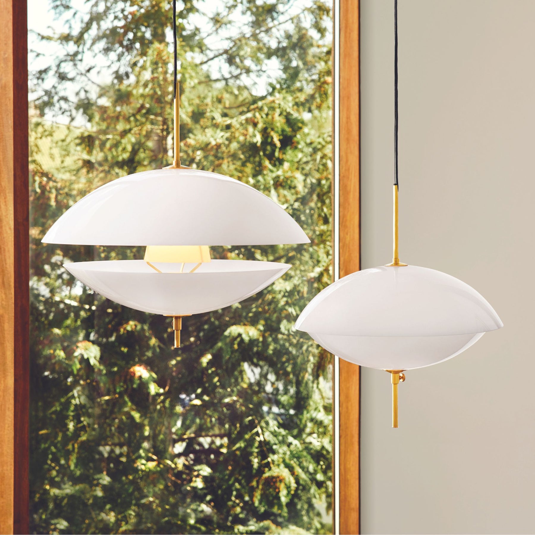 Fritz Hansen Clam Pendants Opal Glass and Brass One Open One Closed by Window