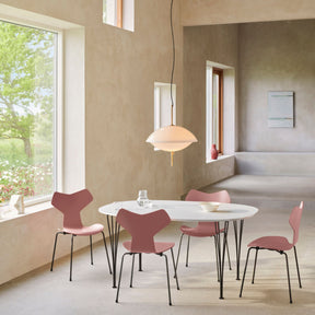 Fritz Hansen Grand Prix Chairs Wild Rose Colored Ash in Room with Super Elliptical Dining Table and Clam Pendant