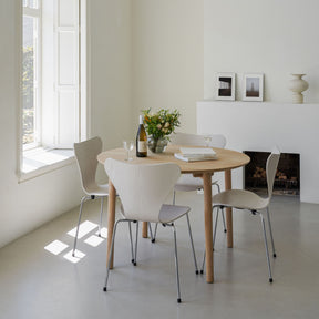 Fritz Hansen Hven Dining Table Round with Series 7 Chairs by Fireplace