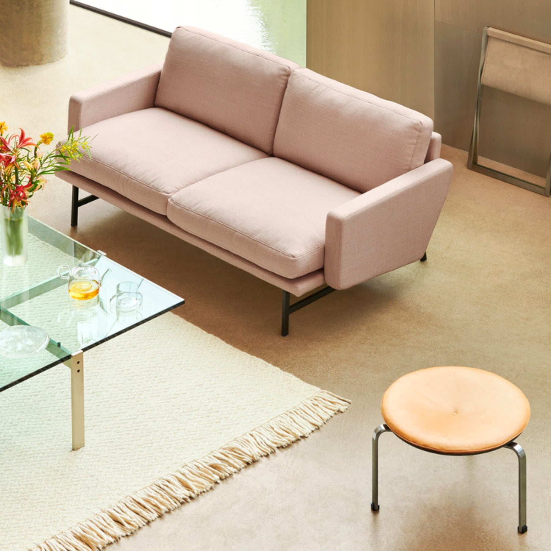 Fritz Hansen Lissoni Sofa Light Pink in room with Poul Kjaerholm coffee Table and Stool