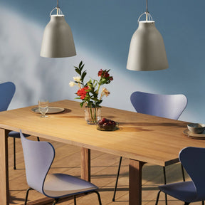 Fritz Hansen Series 7 Chairs with Essay Table and Caravaggio Pendant Lights