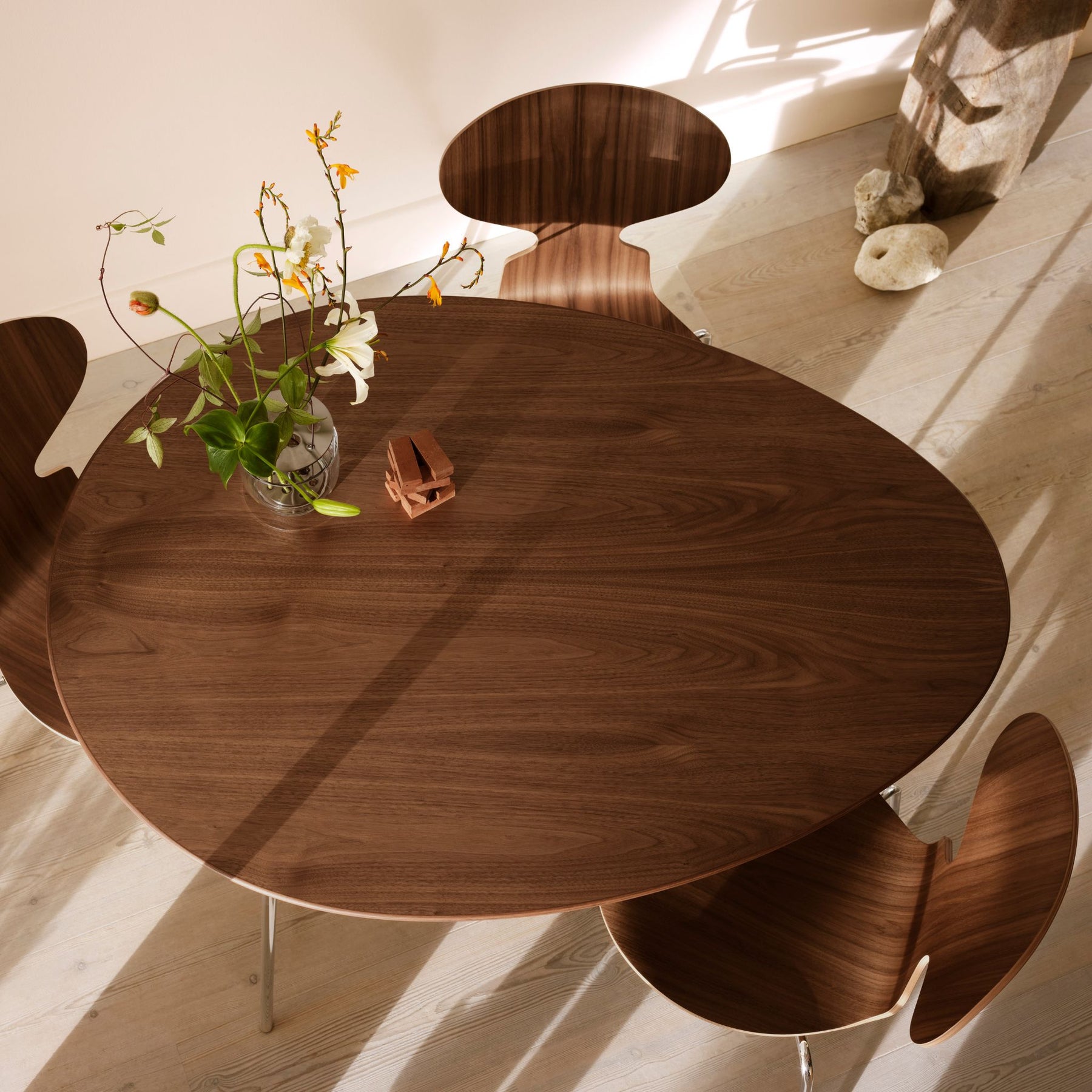 Fritz Hansen Egg Table and Ant Chairs in Walnut  by Arne Jacobsen in Kitchen with Ikebana Vase