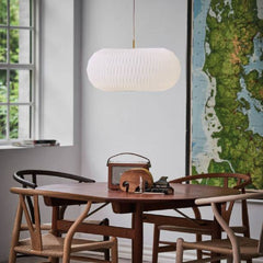 Le Klint Donut Pendant by Lise Navne with Carl Hansen Wishbone Chairs