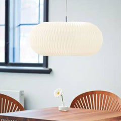 Le Klint Donut Pendant by Lise Navne with Fredericia Trinidad Chairs