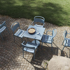 Muuto Linear Steel Cafe Table and Chairs Pale Blue on Stone Patio