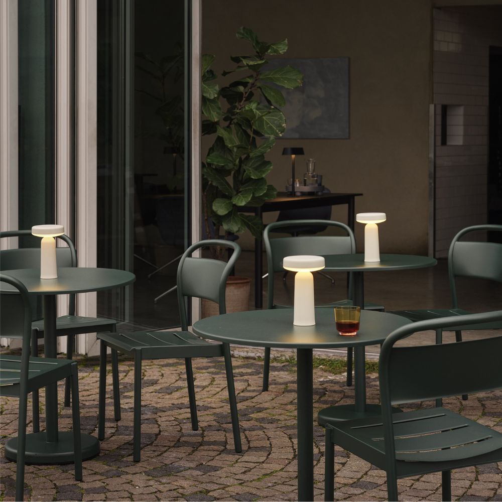 Muuto Linear Steel Cafe Table and Chairs Dark Green on Patio of Copenhagen Cafe