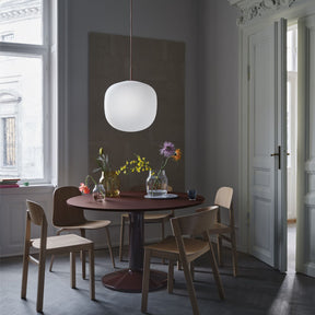 Muuto Rime Pendant Large over Dark Red Midst Dining Table in Copenhagen Apartment