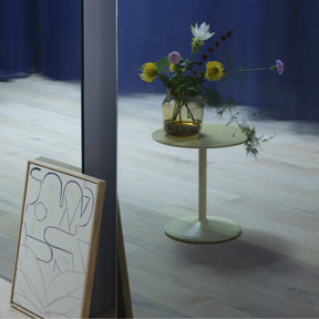 Muuto Soft Side Table Beige Green in Room with Flowers and Art