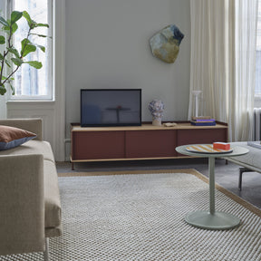 Muuto Soft Side Table Dusty Green in Living Room with Burnt Orange Ply Rug, Enfold Side Board, and Outline Sofa