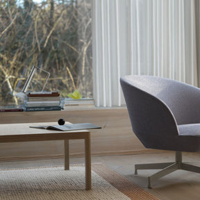 Muuto Workshop Coffee Table by Cecilie Manz in room with Oslo Swivel Lounge Chair