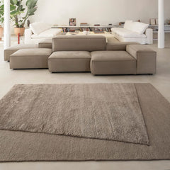 nanimarquina oblique rug obsidian by matthew hilton in modern loft with modular sofa