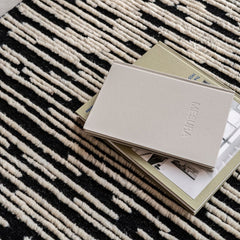 nanimarquina doblecara rug 1 by ronan bouroullec styled with books