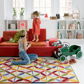 nanimarquina Kala Rug in Playroom with Mother and Child and Vitra Polder Sofa