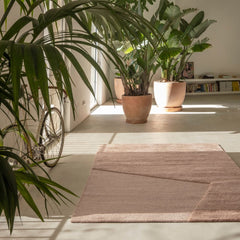 nanimarquina oblique rug pink quartz by matthew hilton in loft with plants